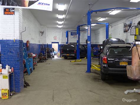 ) Large 14 High x 12 Wide electric overhead shop doors. . Auto shop for rent near me